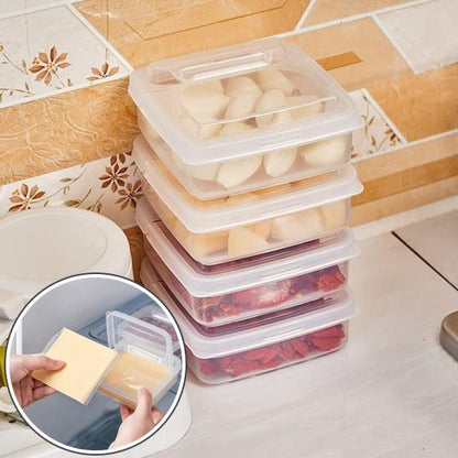 Rangement frigo contenant des fruits et de l'ail